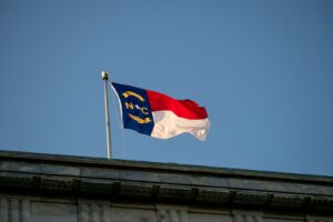 a flag flying on top of a building